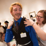 Brandon Thompson, center, and Alex Foster laugh while practicing taking measurements during The Art of Costume Design workshop presented by Diana Eden. (AJ Reynolds/Brenau University)